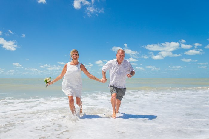 Beach wedding at noon Sanibel beach wedding