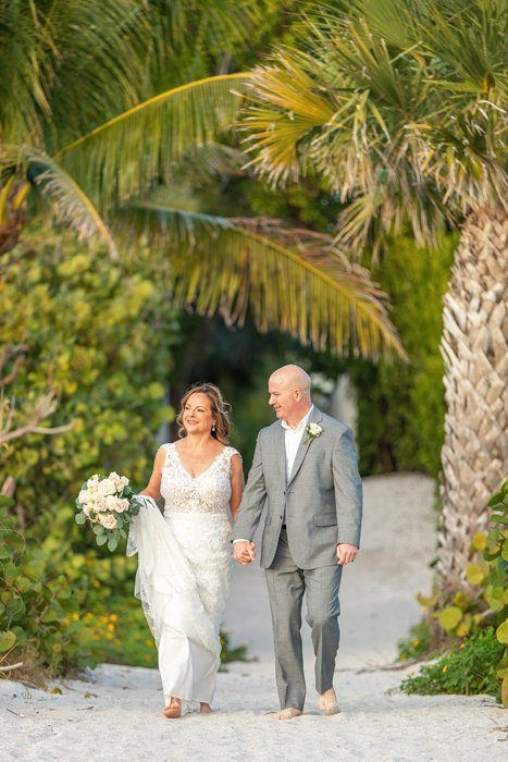 wedding couple enjoy pictures after ceremony Sanibel Elopement